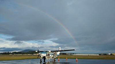 Image of C208 Aircraft AFJ with rainbow