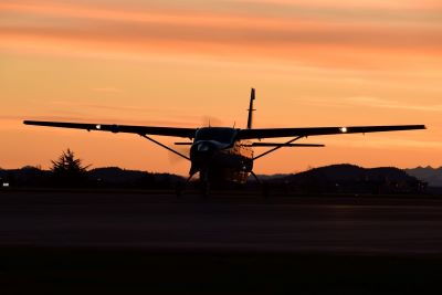 Image of C208 Aircraft against sunset