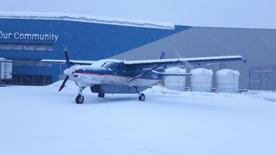 Image of C208 Aircraft LGA parked in snow